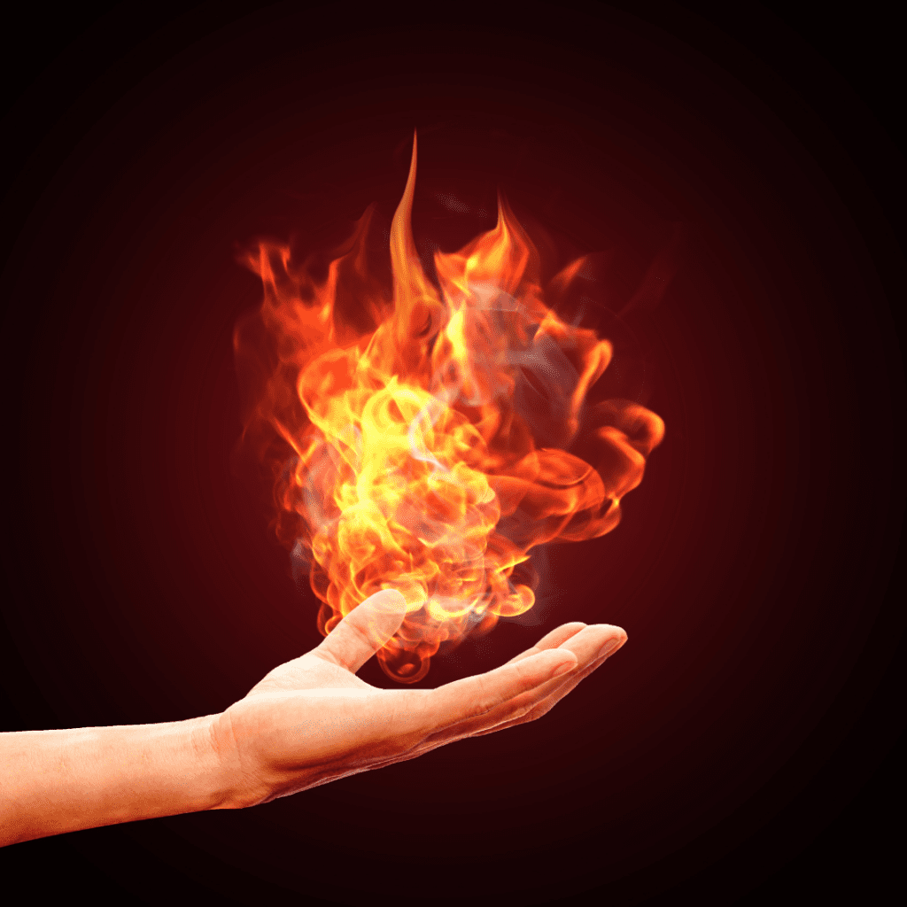 A hand holds out a flame to reconnect with the world